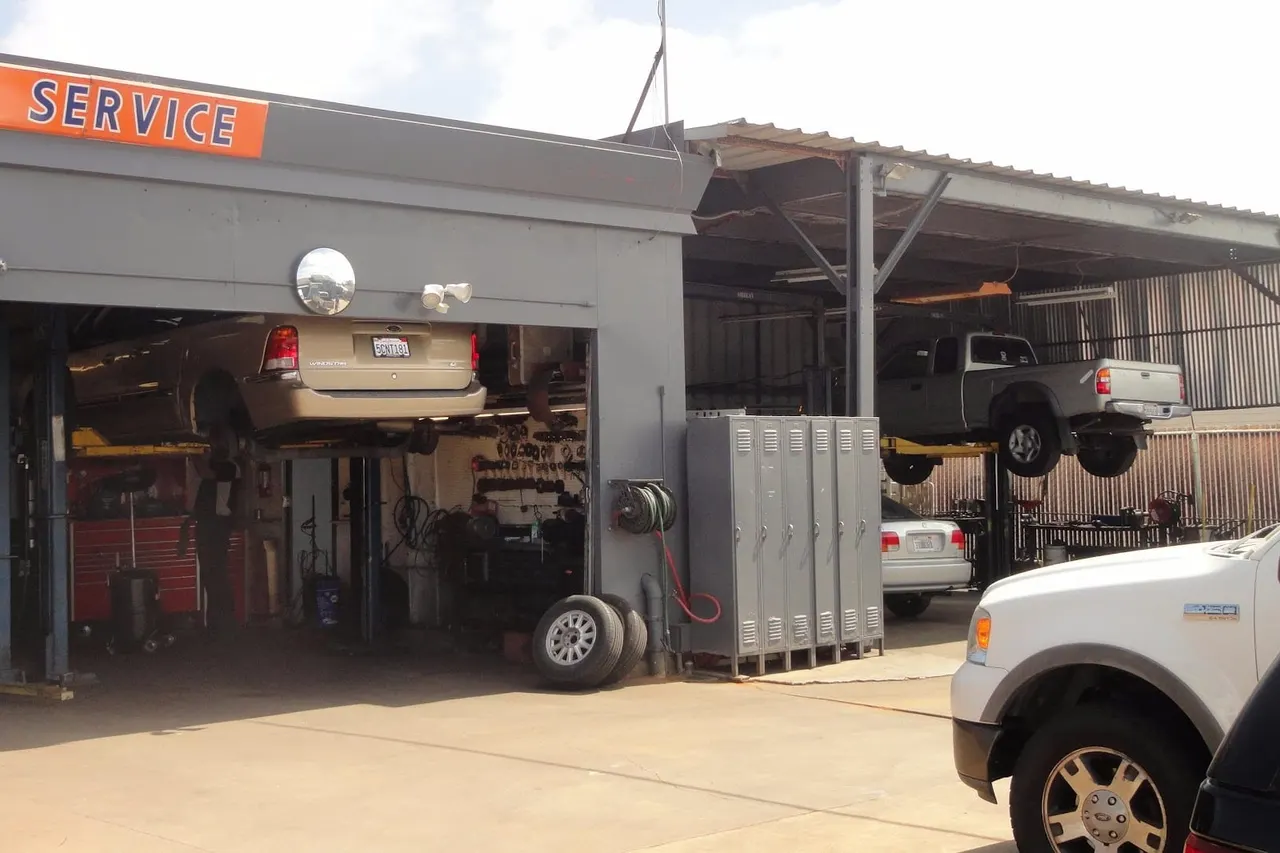 Open shop bay with vehicles on lifts